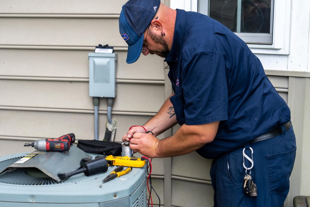 Burch_ActionShots-41 Burch technician maintaining an HVAC unit