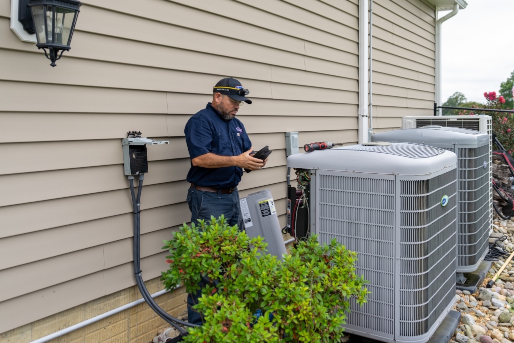 Burch_ActionShots-80 Burch technician working on a heat pump.