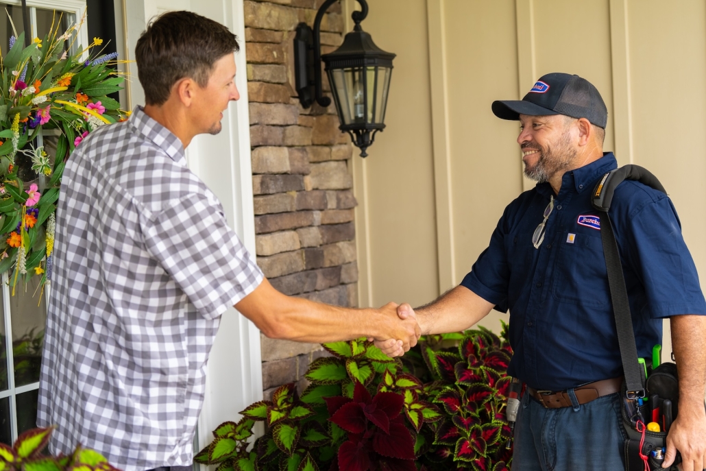Burch_CustomerInteraction-20 Burch technician shaking hands with customer after discussing their HVAC, propane and heating oil needs.