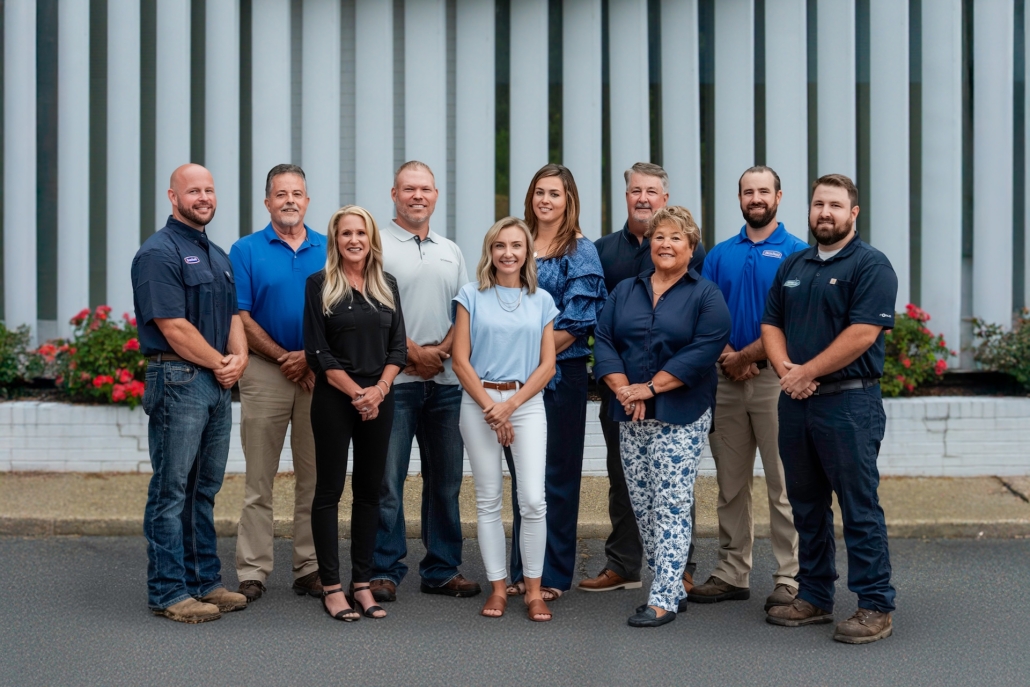Burch team members in front of building
