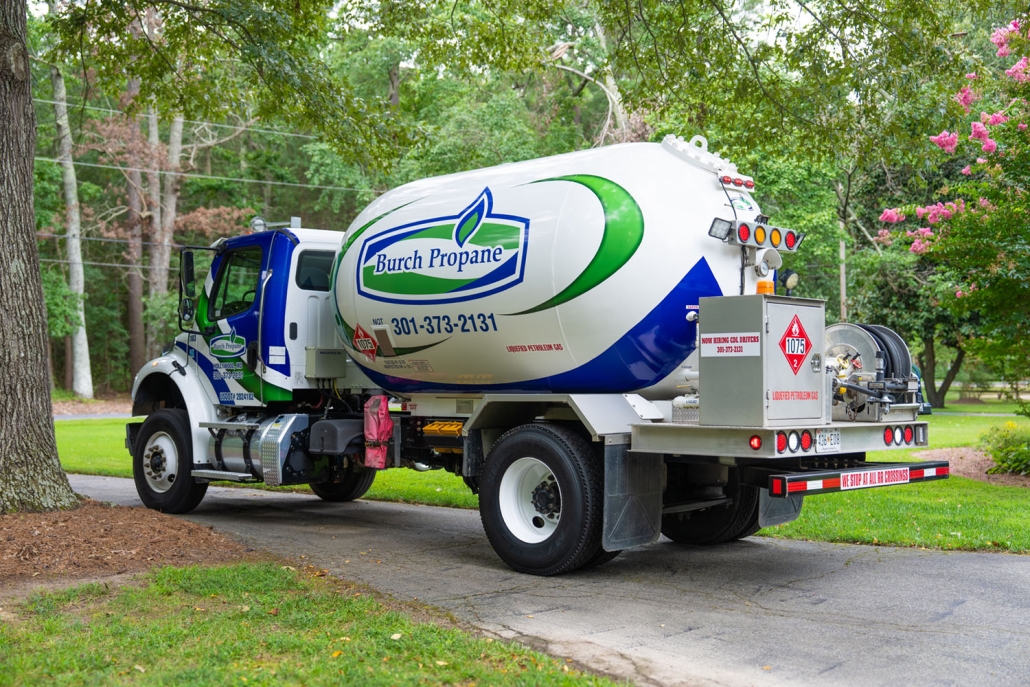 Burch propane truck in front of trees