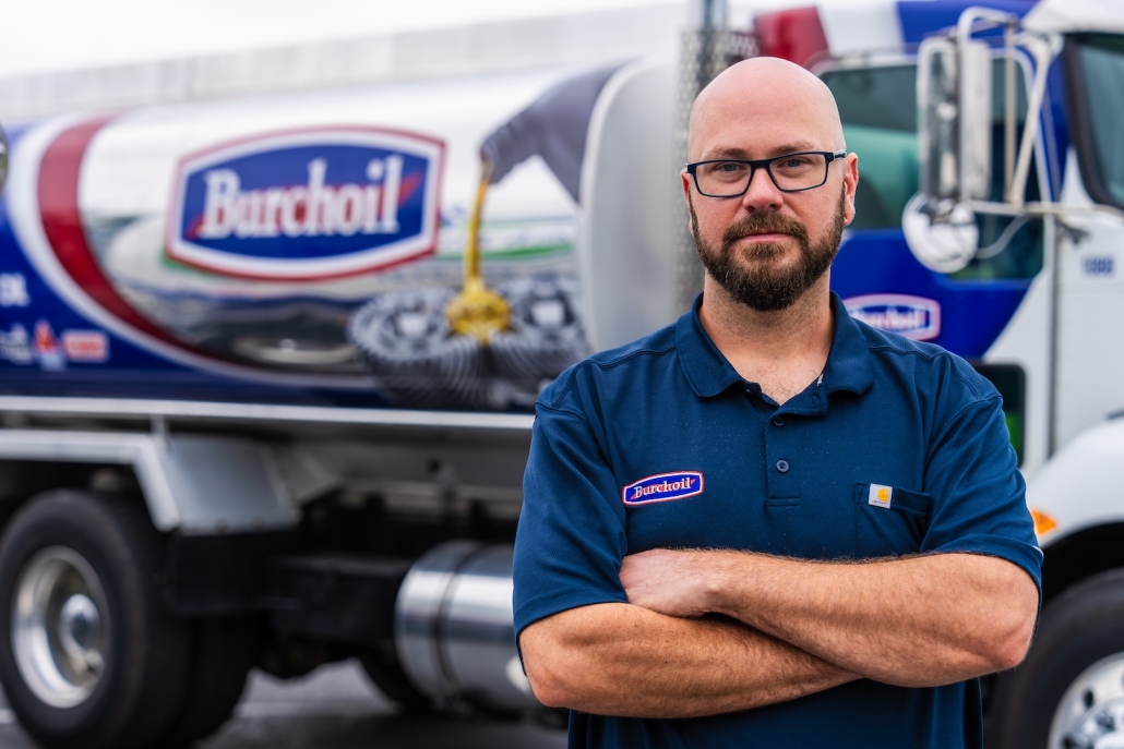 Burch employee in front of propane truck
