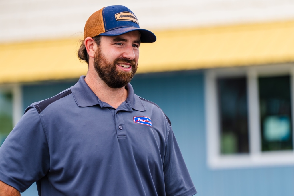 employee in hat smiling