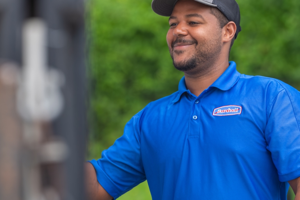 maintenance employee at customer's home smiling