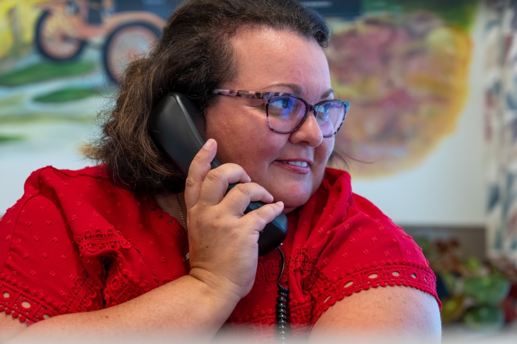 Burch employee answering office phone