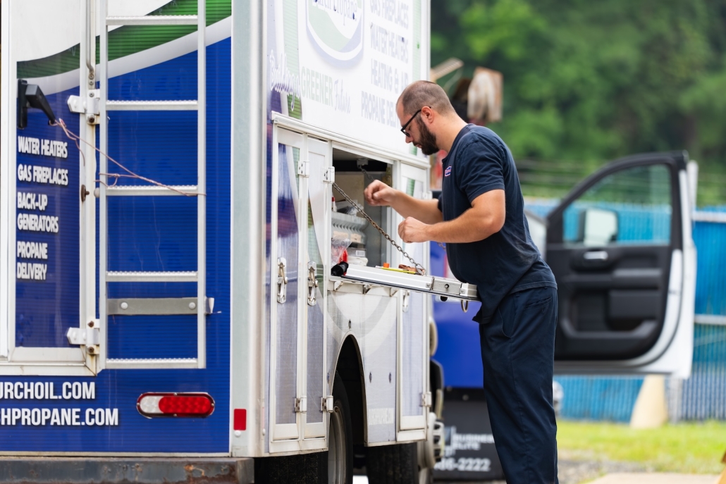 Burch_ActionShots-130 Burch employee finds tools in the work truck