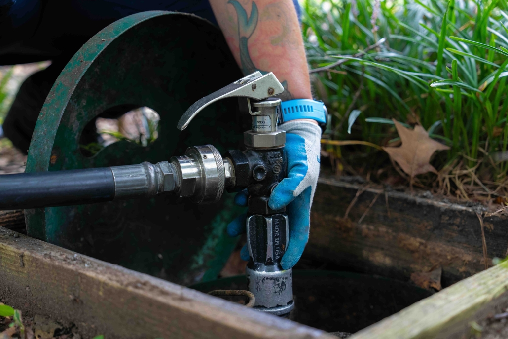 Burch worker refilling underground propane tank