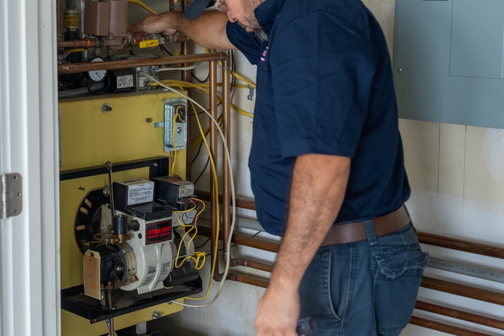 Burch worker maintaining a boiler system