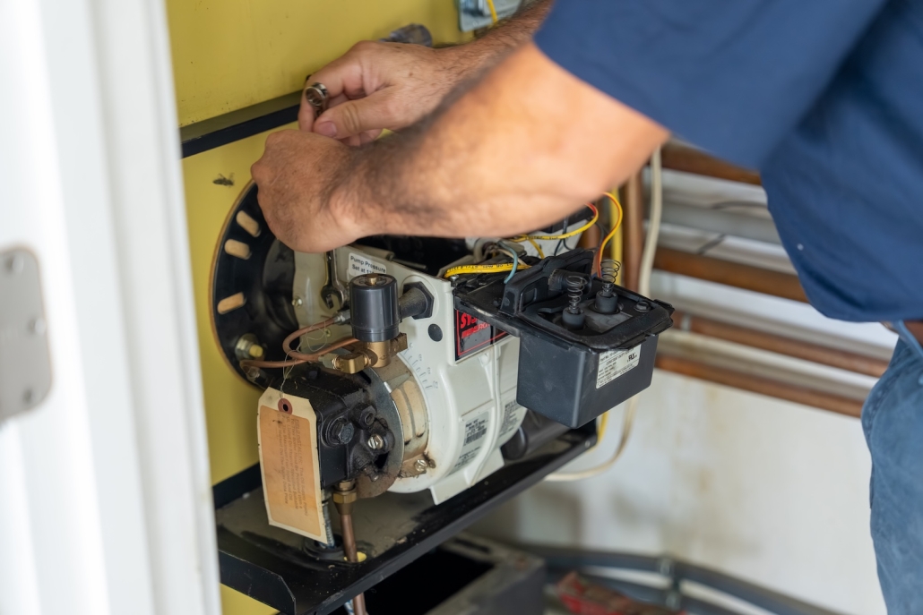 Burch_ActionShots-74 Burch worker maintaining a boiler system