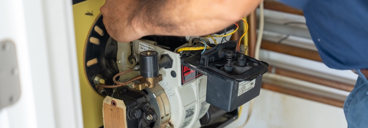 Burch worker maintaining a boiler system