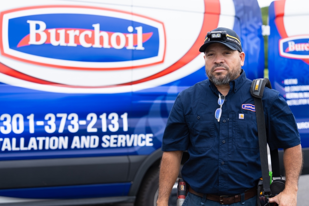 Burch_ActionShots-79 Burch worker in front of work van carrying tools