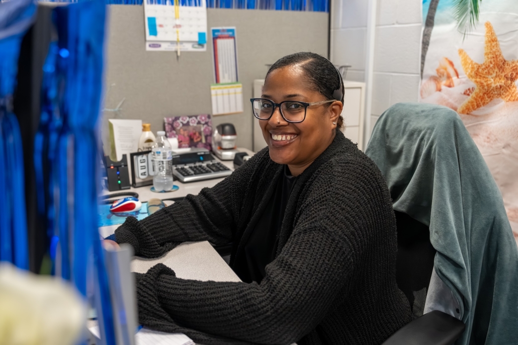 Burch_ActionShots-9 Burch employee smiling at a desk