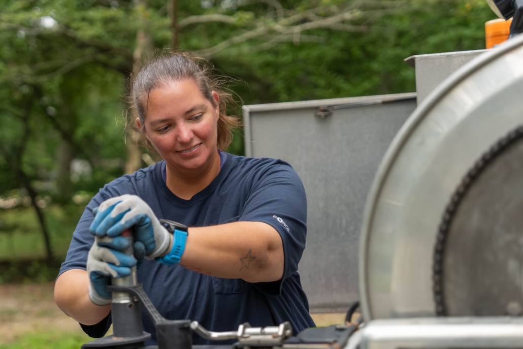 worker adjusting fuel pump