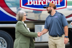 Burch technician shaking hands with customer after discussing their HVAC, propane and heating oil needs.