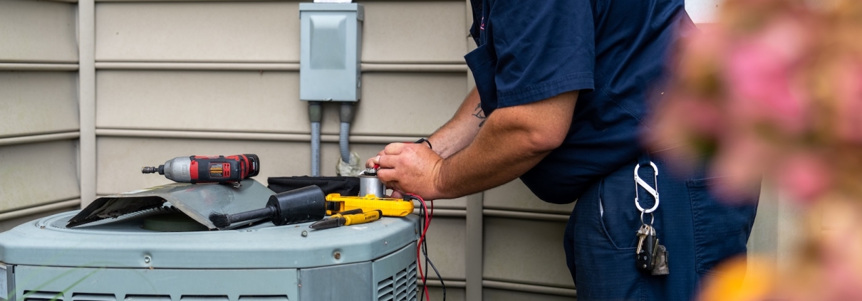 HVAC system being fixed by Burch employee