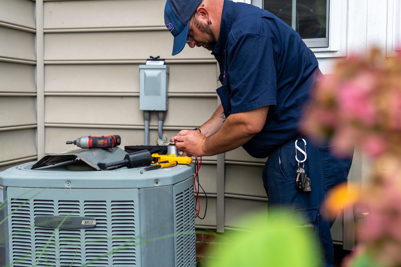 HVAC system being fixed by Burch employee