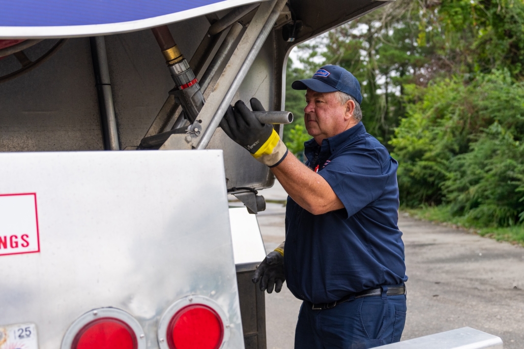 Burch technician beside delivery truck